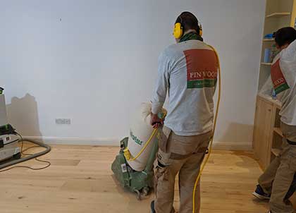 Sanding both flooring surfaces