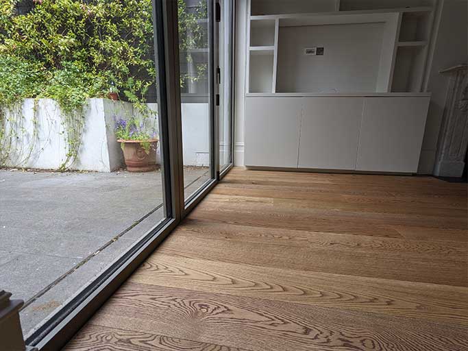 There are no thresholds or beading as the wood floor seamlessly meets the bifold doors #CraftedForLife