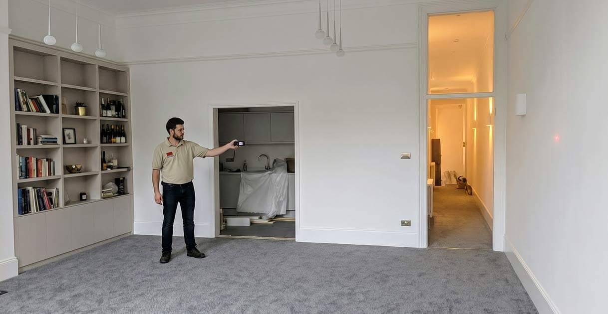 Fin Wood specialist taking precise laser measurements of a room during an initial site consultation Fin Wood specialist taking precise laser measurements of a room during an initial site consultation #CraftedForLife