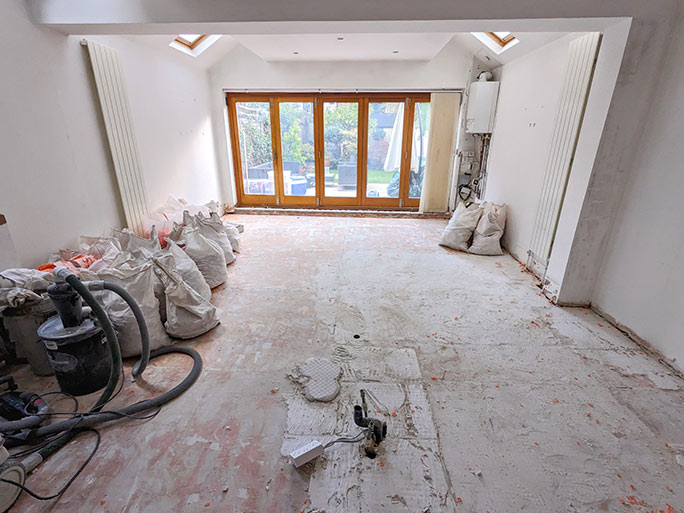 Grinding uneven concrete subfloor before wood floor installation #CraftedForLife