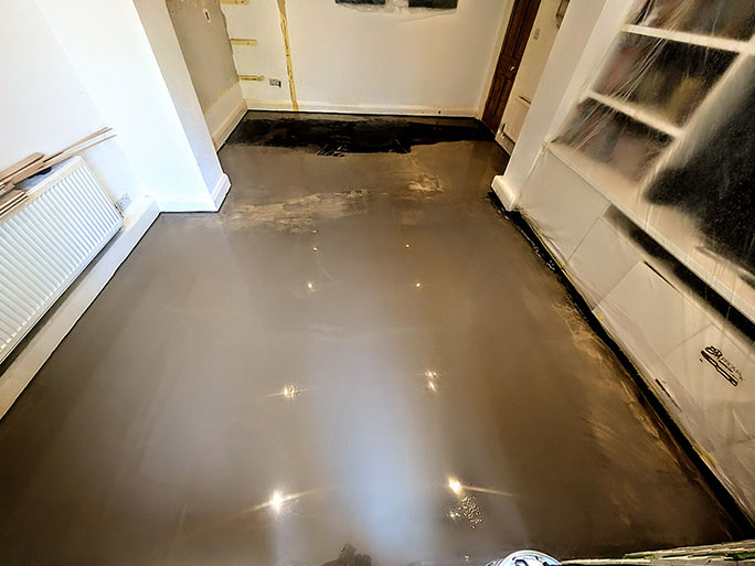 Applying polyurethane epoxy DPM on a concrete screed subfloor #CraftedForLife