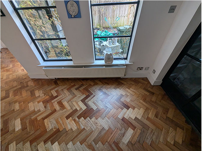 The kitchen featured a reclaimed herringbone parquet in Jatoba wood #CraftedForLife