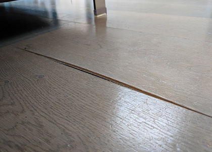 Movement due to excessive heat in an engineered wooden floor